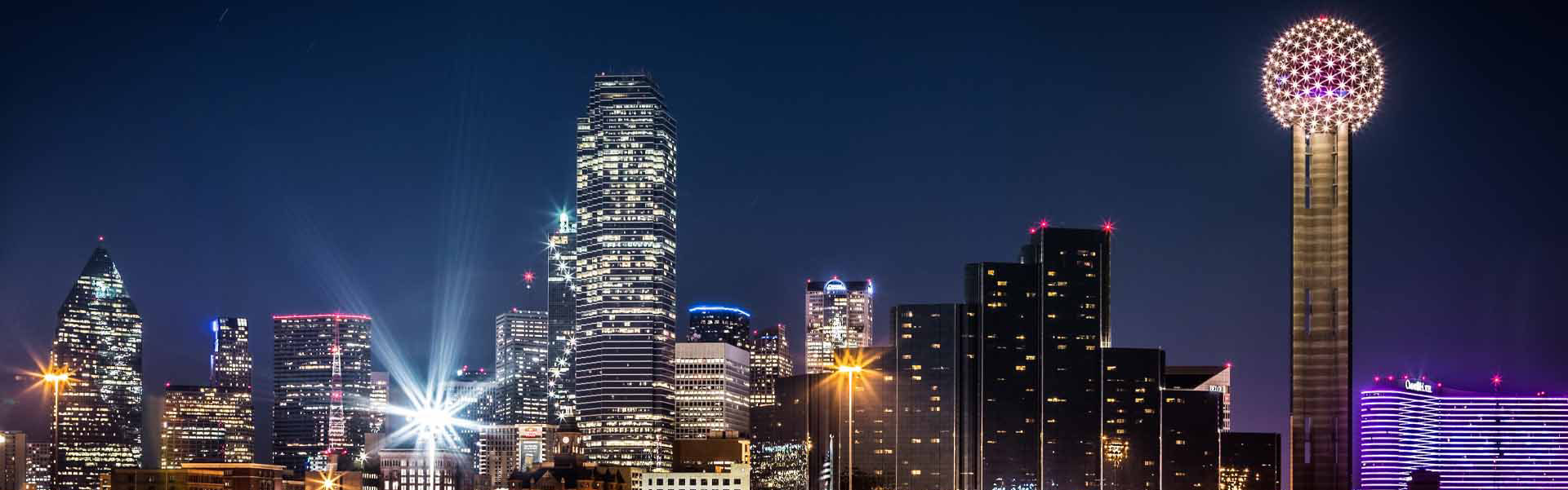 Neon color image of a band playing and people singing along
