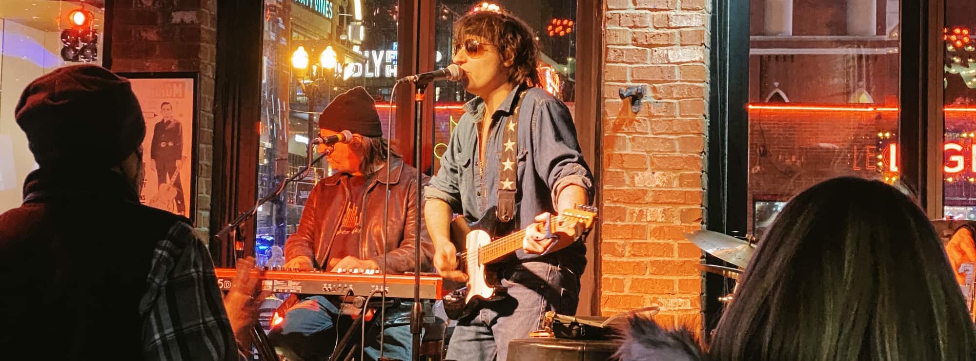 bar singer on guitar in Dallas